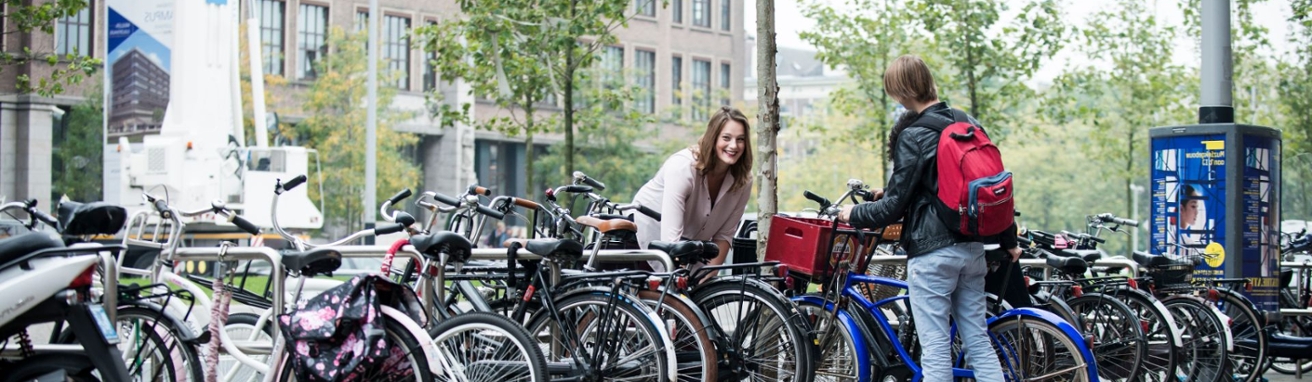 students parking their bike outside the AUAS building