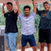 Ricardo, AMSIB Student, holds upcycled mattress with 3 others